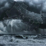 Cyclone Ditwah approaching Indian coastline with dark clouds and high sea waves.